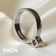 Load image into Gallery viewer, White gold ring with a diamond on a white background, branded 'MION'.