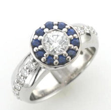 Load image into Gallery viewer, 18ct white gold ring, featuring a striking star-shaped setting surrounded by a halo of sapphire petals, with diamonds extending along the shoulders.